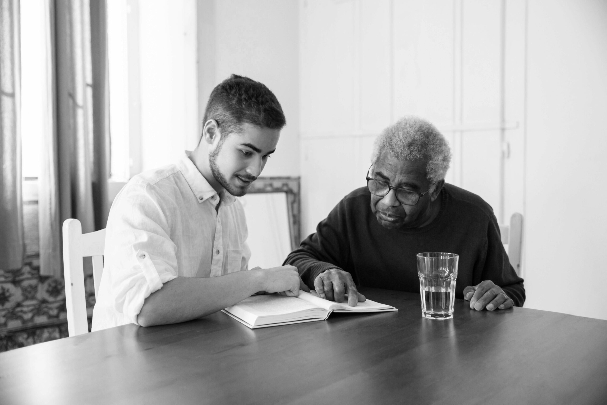 old man and young man reading